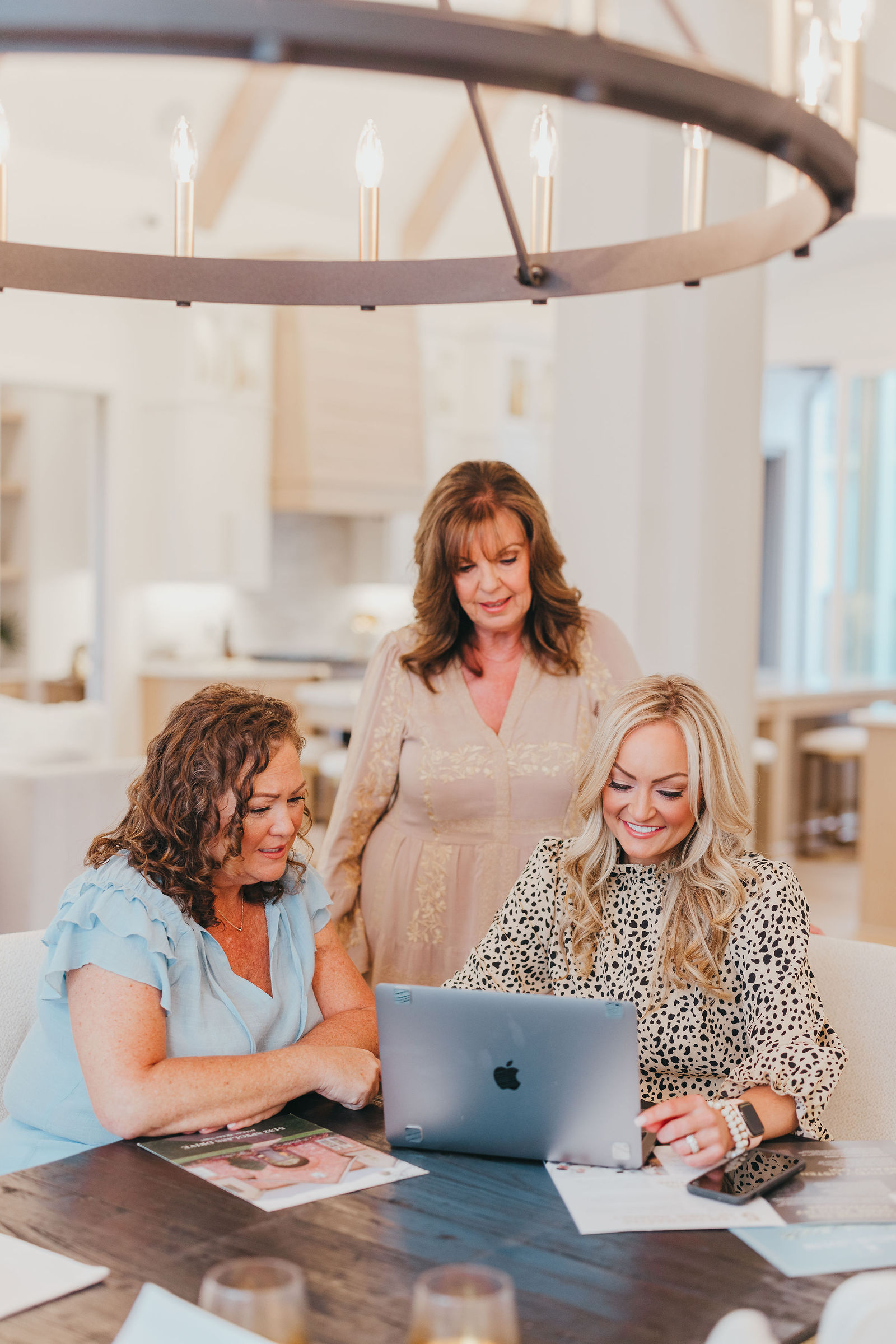 The Kaitlin Lovern Real Estate Team reviewing offers with a North Dallas home seller