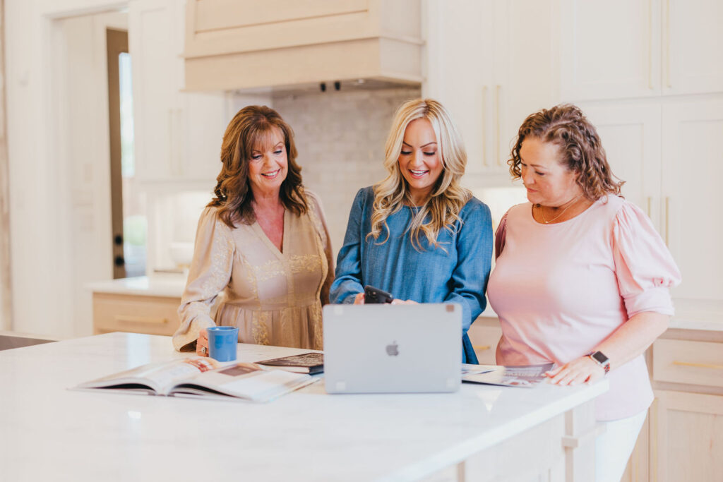 The Kaitlin Lovern Real Estate Team reviewing a cash offer together