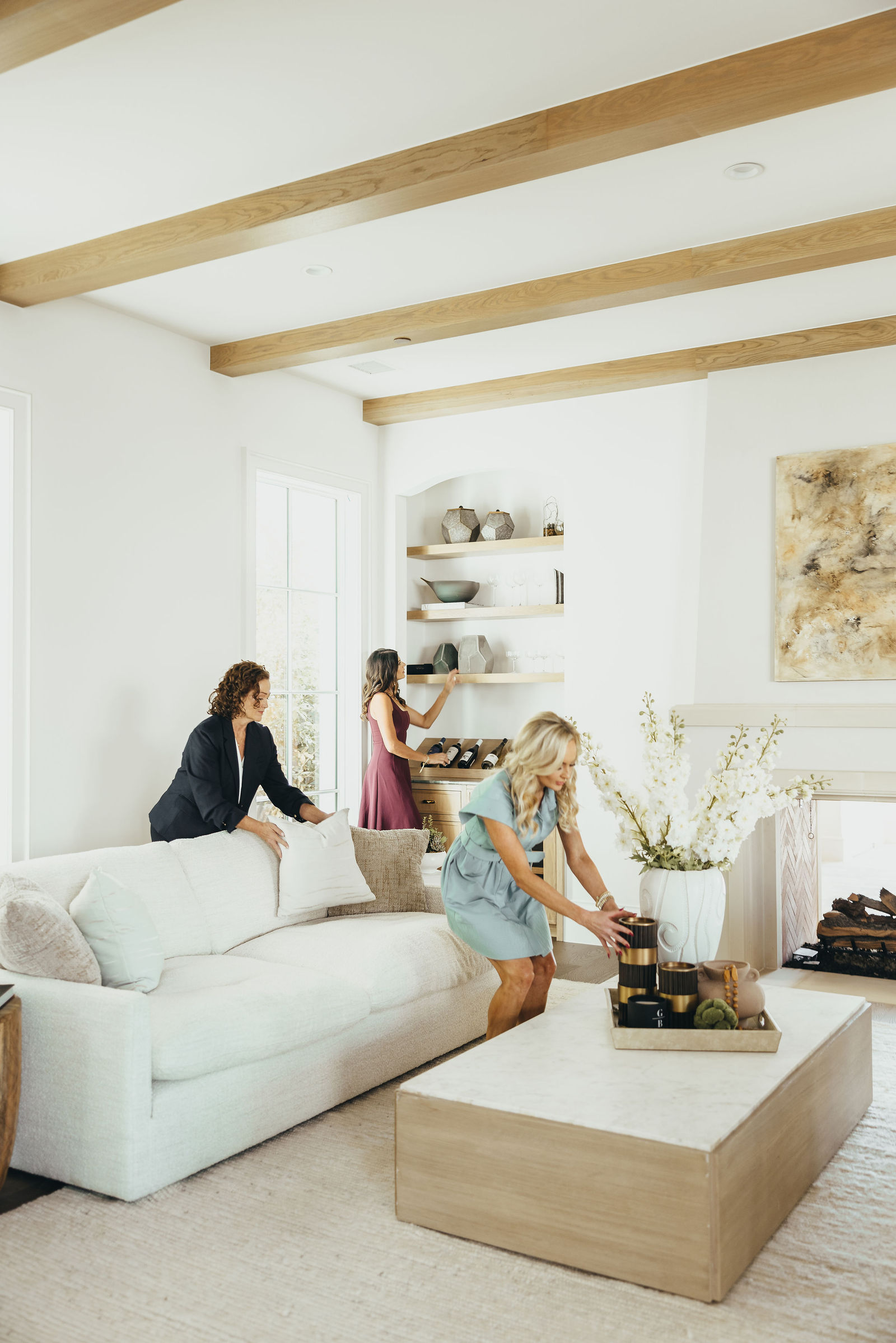 Kaitlin Lovern and team members preparing a residential living room